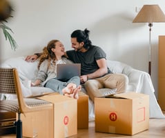 Couple with computer packing boxes